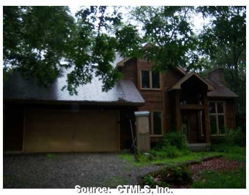 40 Stanley Road Windham, CT 06280 - Photo 1 of 1 a front view of a house with a garden