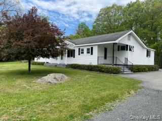 100 Decker Road, Unit 2 Wallkill, NY 12589 - Photo 2 of 23 a front view of a house with garden