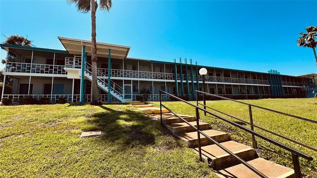 a view of a swimming pool with a deck