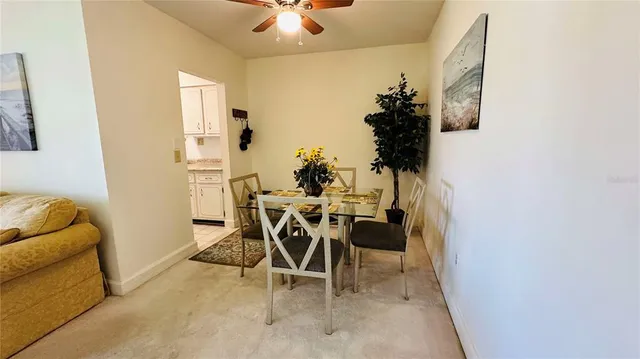 a view of a livingroom with furniture and a potted plant