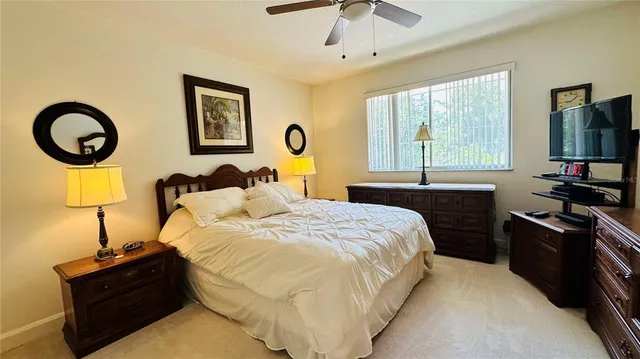 a bedroom with bed and a window