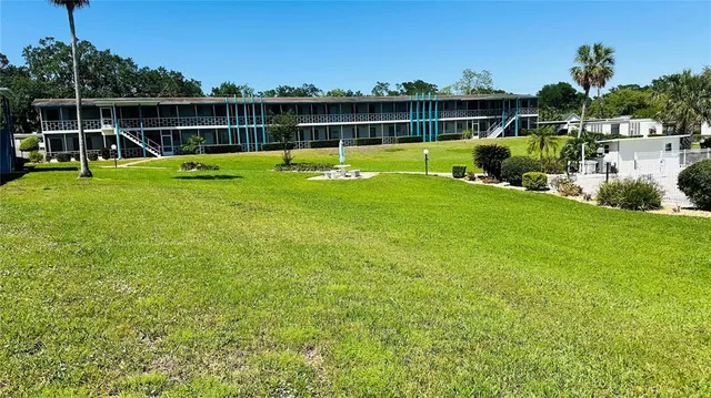 a view of a swimming pool with lounge chairs