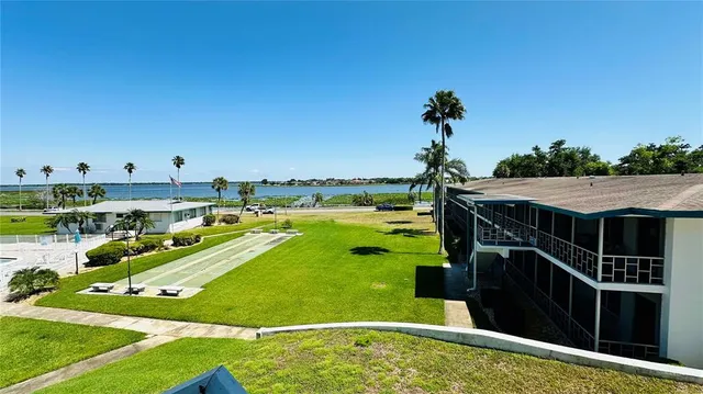 a view of a swimming pool with an outdoor seating and yard