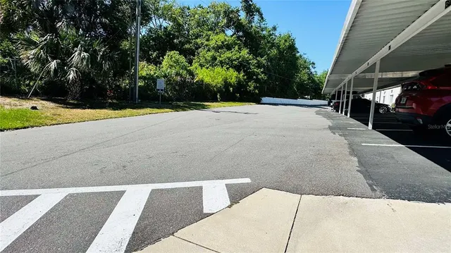 a view of a backyard with swimming pool