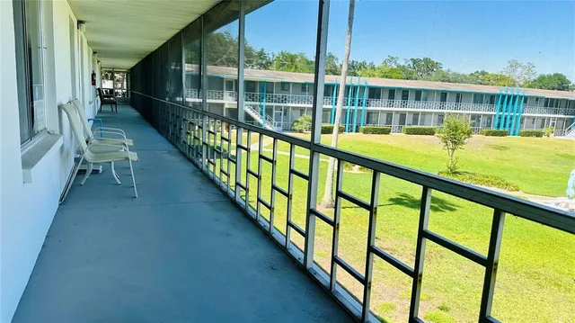 a view of swimming pool with balcony