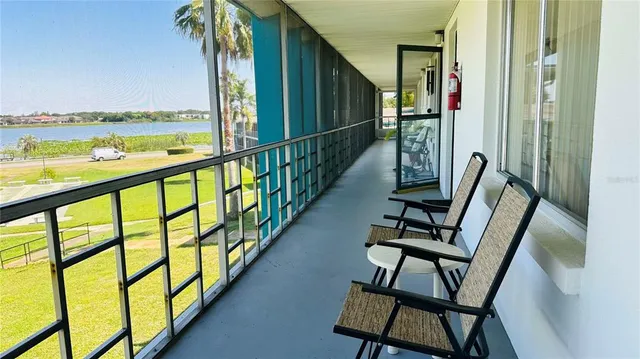 a view of balcony with furniture