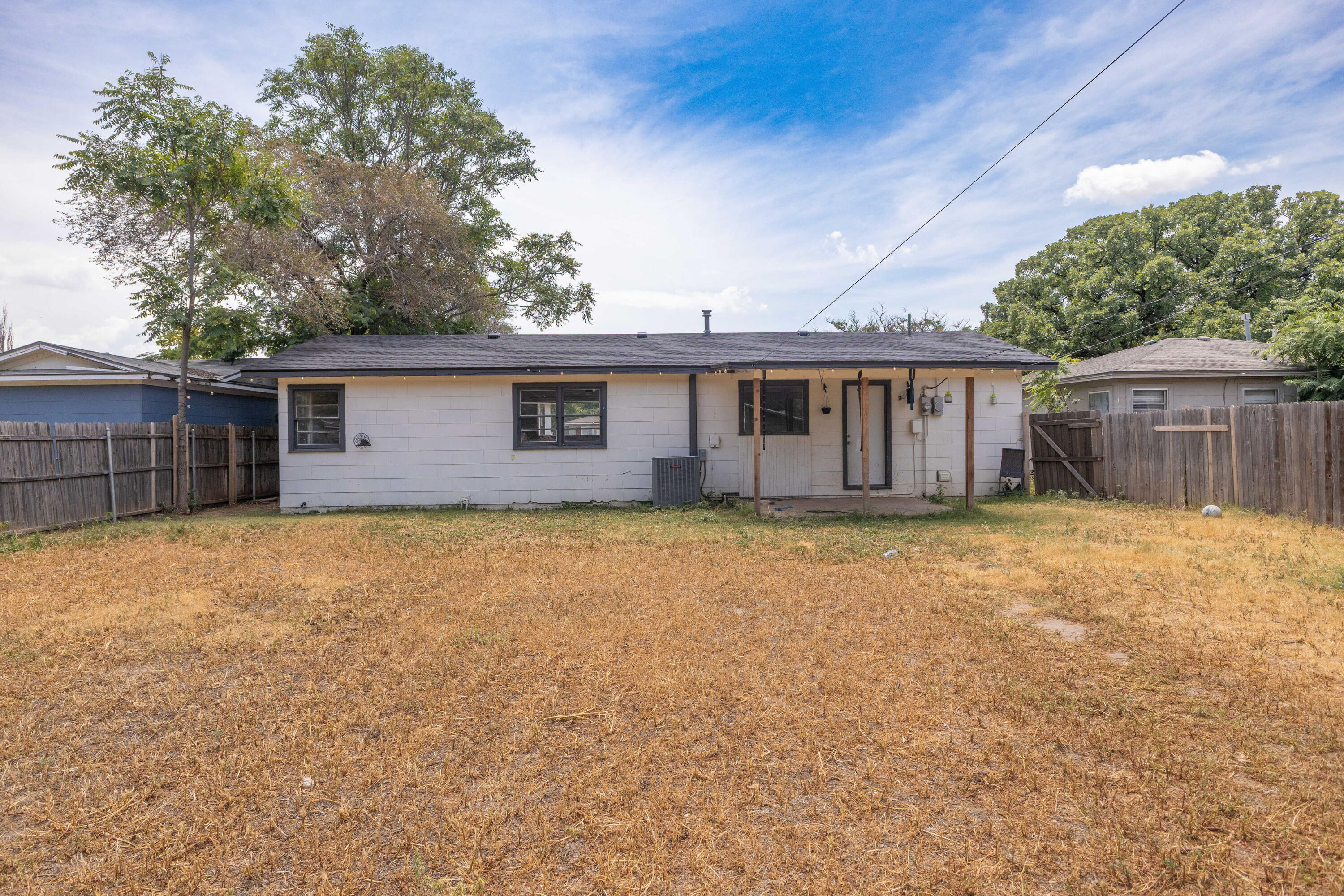 3812 31st Street Lubbock, TX 79410 - Photo 15 of 16 front view of a house with a yard