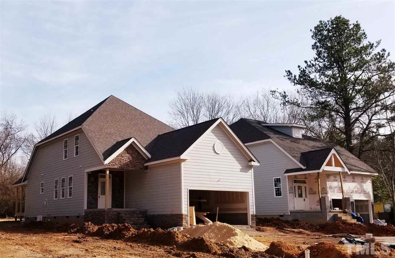 447 Rose Lane Raleigh, NC 27610 - Photo 1 of 8 a front view of a house with a yard