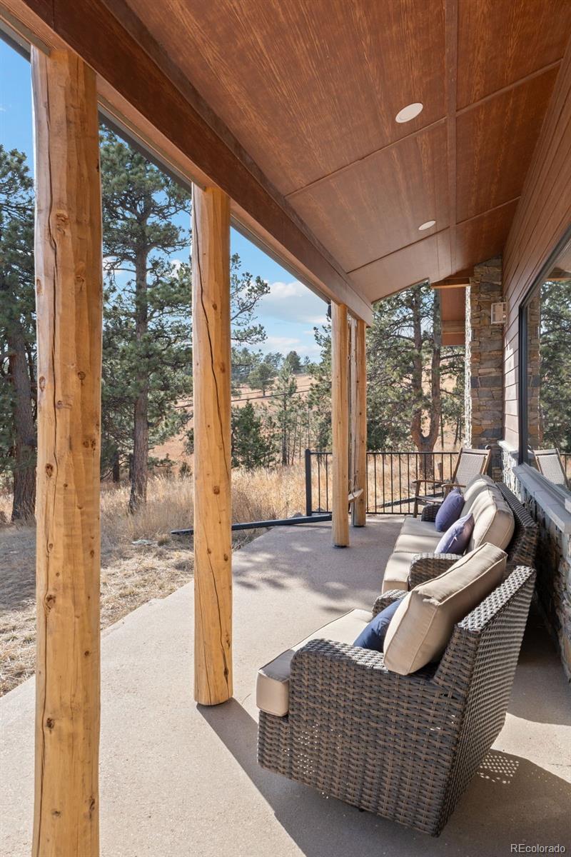 25350 Ridge Way Golden, CO 80401 - Photo 3 of 47 a living room with furniture and a floor to ceiling window
