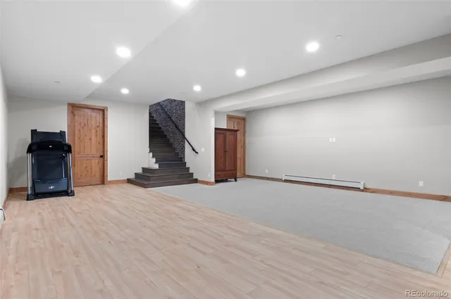 a view of backyard with outdoor seating and trees