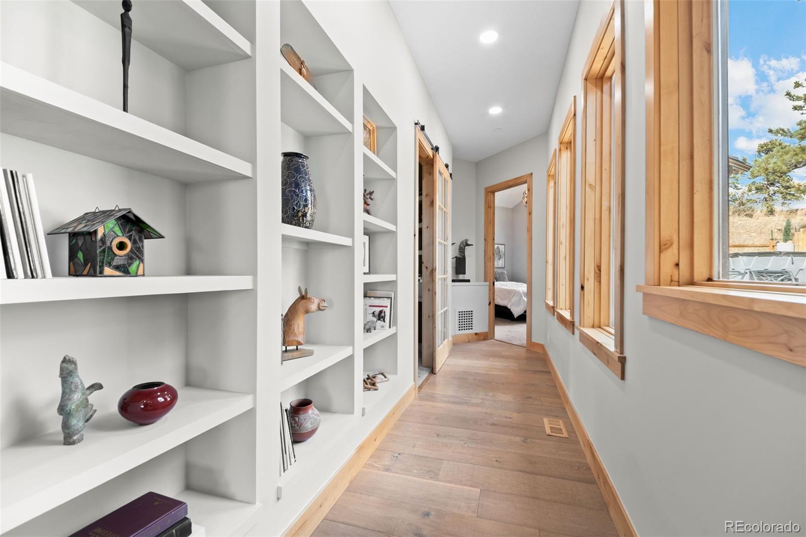 25350 Ridge Way Golden, CO 80401 - Photo 35 of 47 a hallway with white cabinets and window