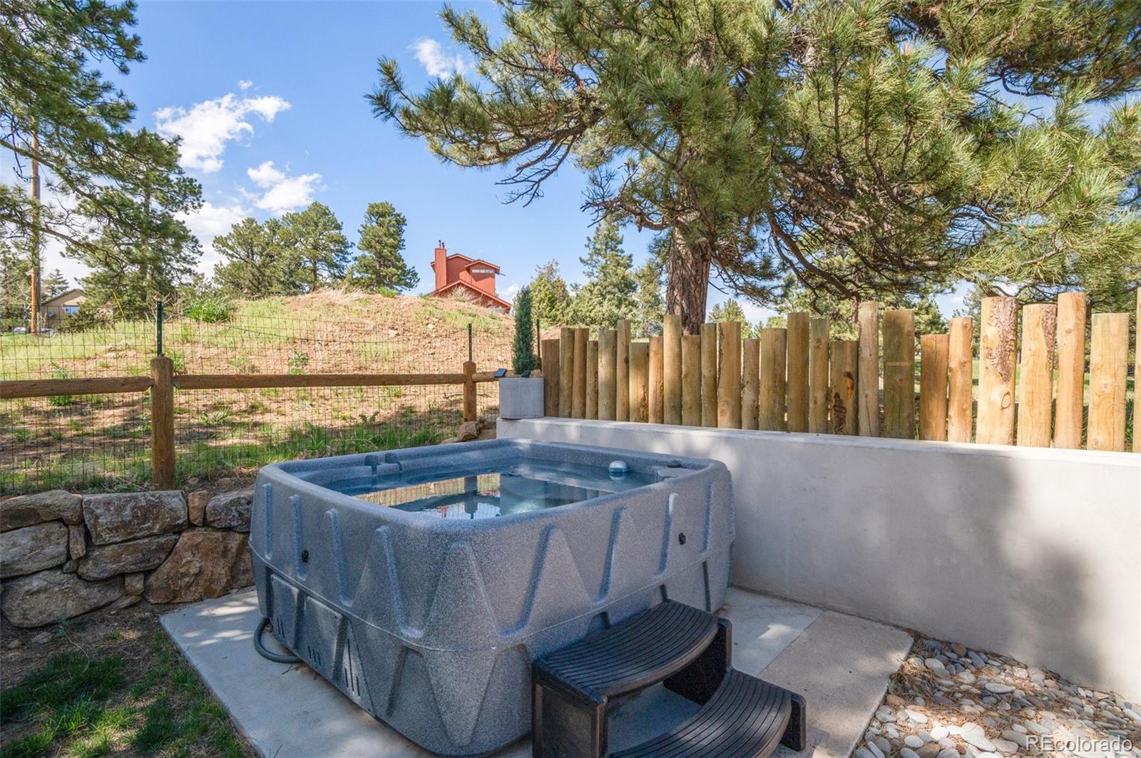 25350 Ridge Way Golden, CO 80401 - Photo 38 of 47 a outdoor living space with furniture and city view