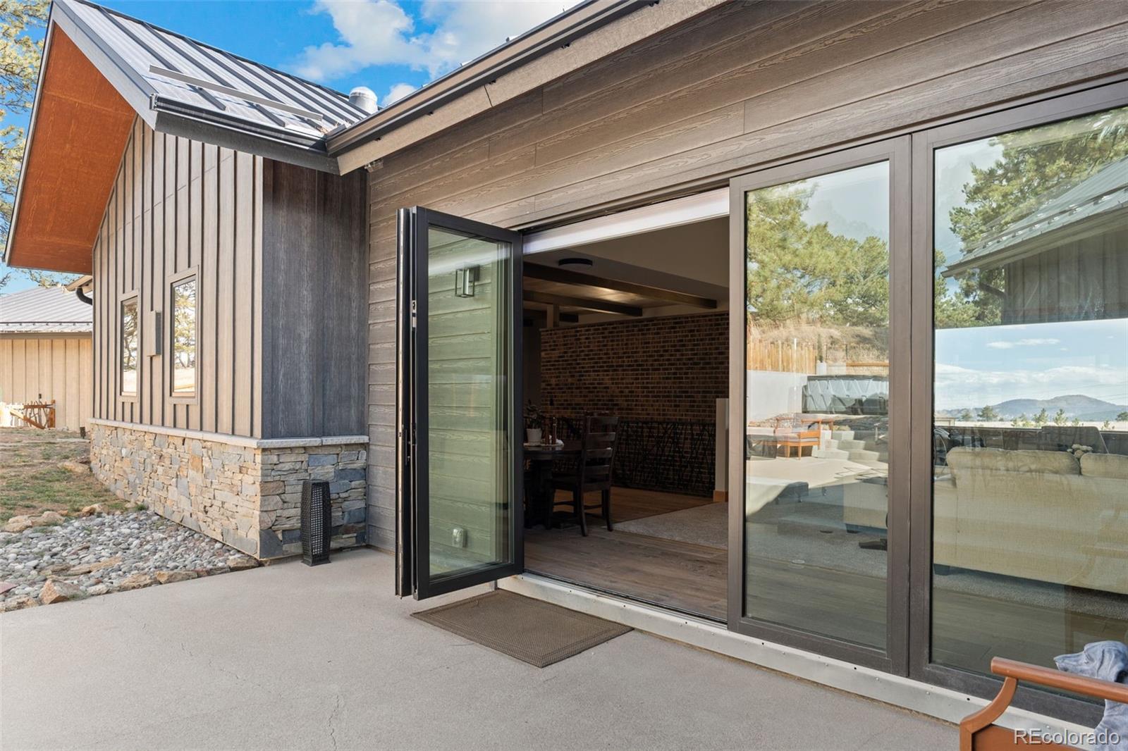 25350 Ridge Way Golden, CO 80401 - Photo 42 of 47 a view of a hallway with a glass door and balcony