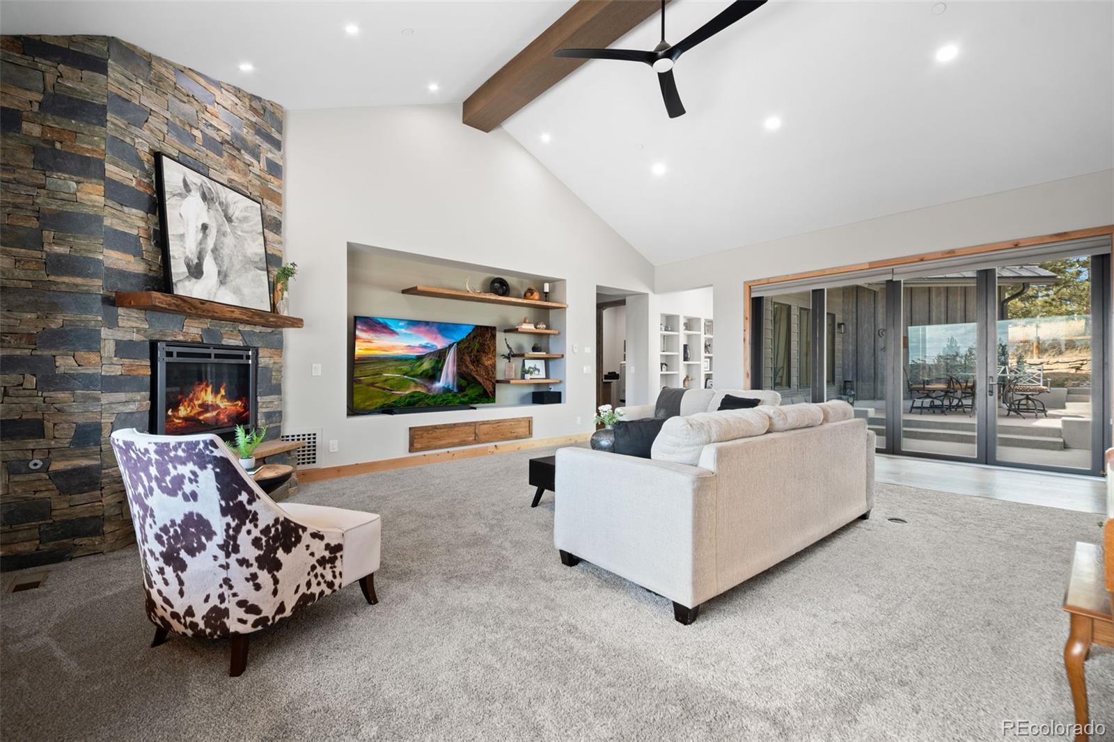 25350 Ridge Way Golden, CO 80401 - Photo 7 of 47 a living room with furniture and a flat screen tv