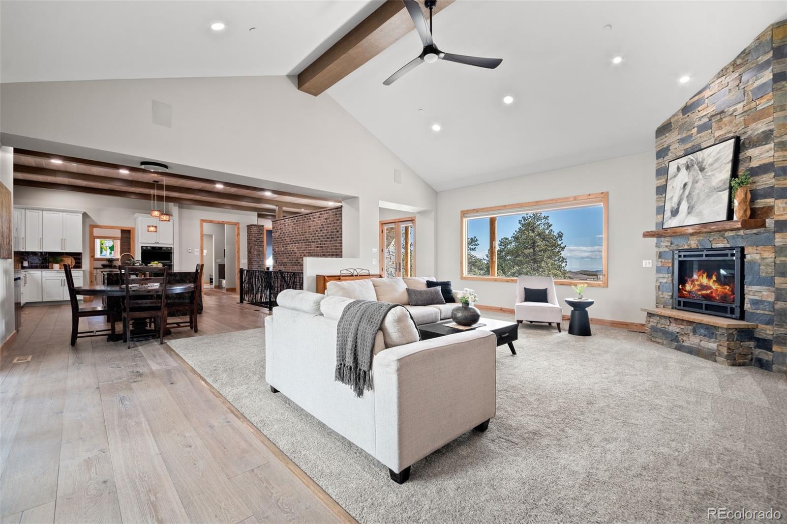 25350 Ridge Way Golden, CO 80401 - Photo 8 of 47 a living room with furniture and a fireplace