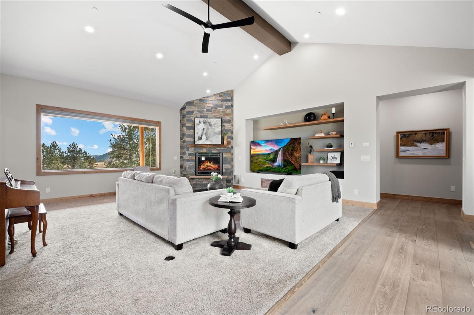 25350 Ridge Way Golden, CO 80401 - Photo 9 of 47 a living room with furniture and a flat screen tv