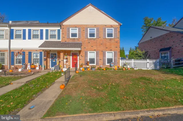 a front view of a house with yard