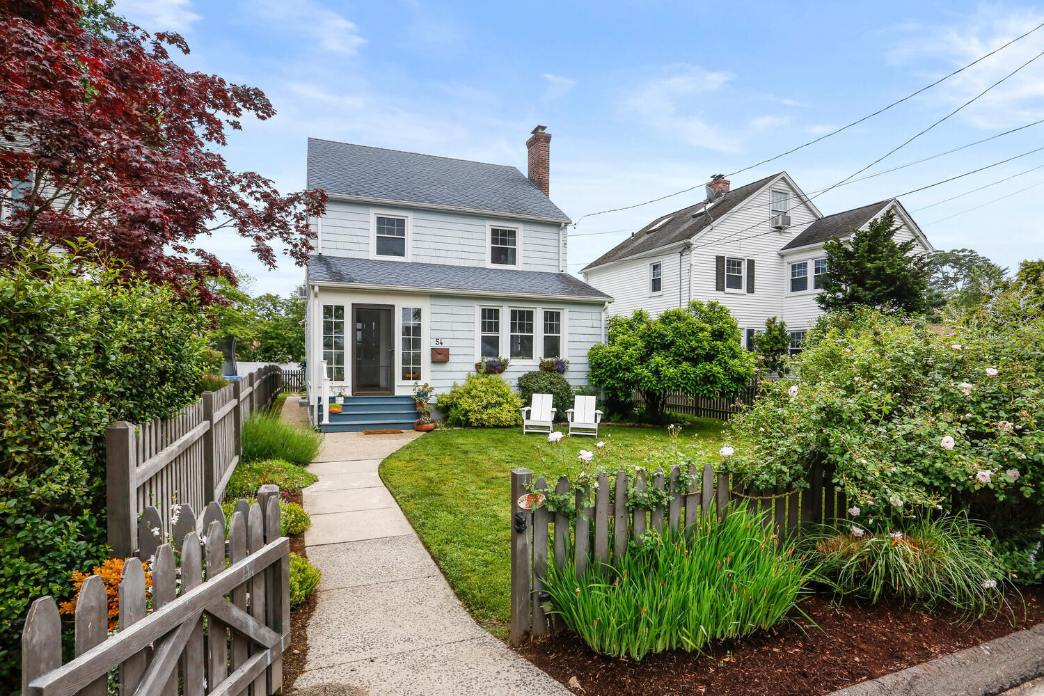54 Ridgewood Avenue Stamford, CT 06907 - Photo 27 of 31 a front view of a house with garden