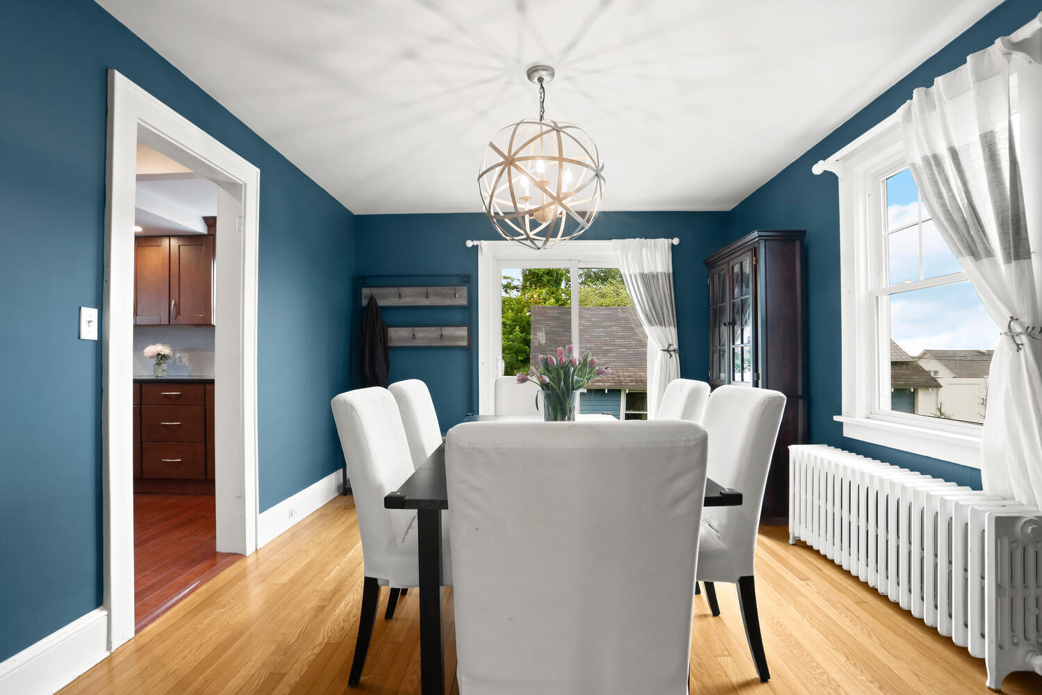 54 Ridgewood Avenue Stamford, CT 06907 - Photo 10 of 31 a view of a dining room with furniture wooden floor and chandelier