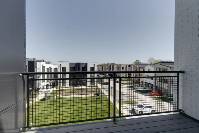 a view of balcony with wooden floor