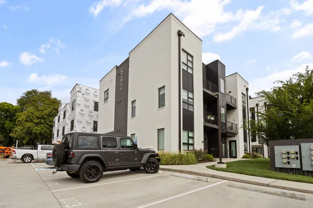 a view of street with parked cars