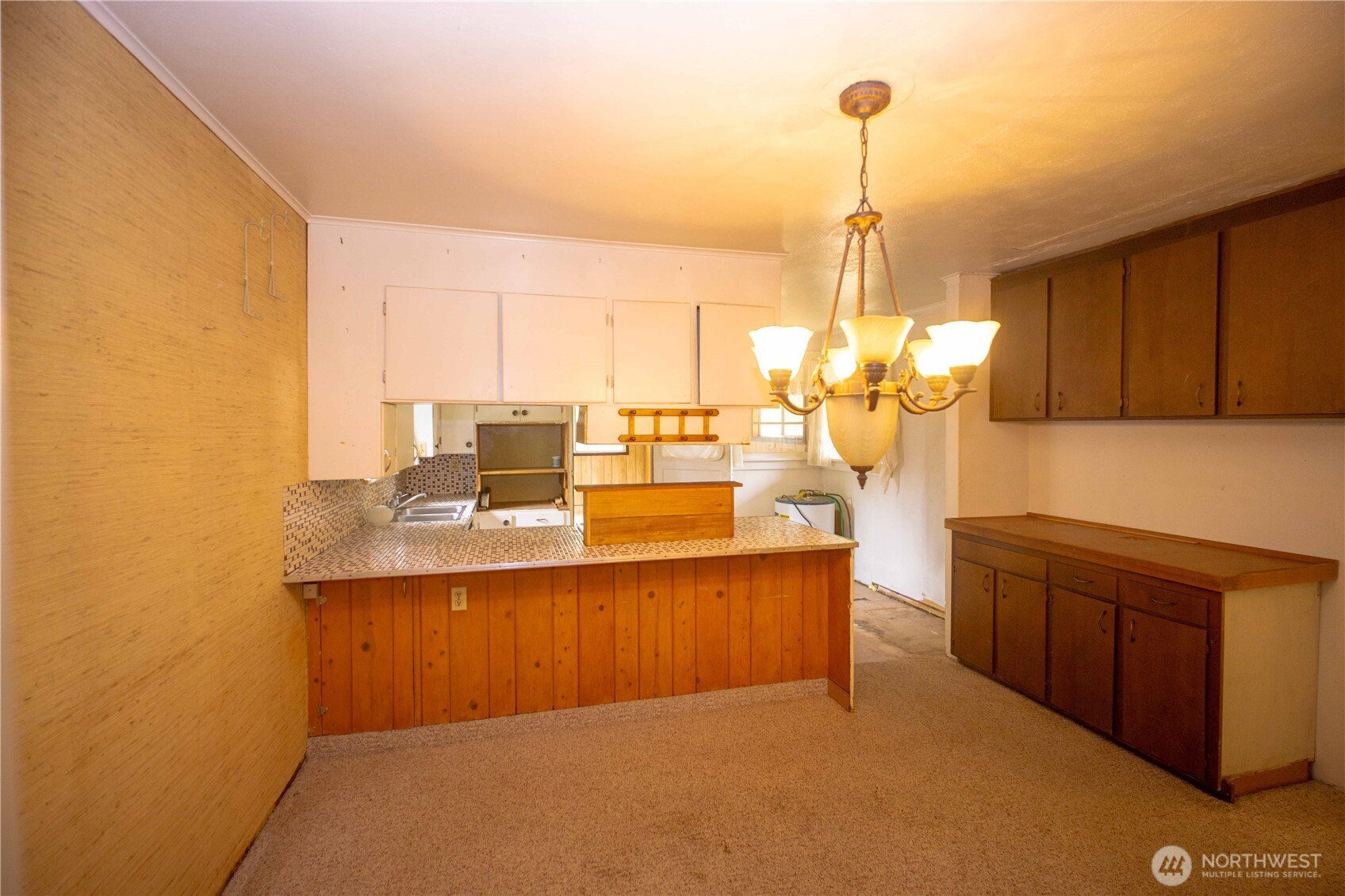 1122 West Spruce Street Port Angeles, WA 98363 - Photo 6 of 30 a kitchen with stainless steel appliances kitchen island granite countertop a sink and cabinets