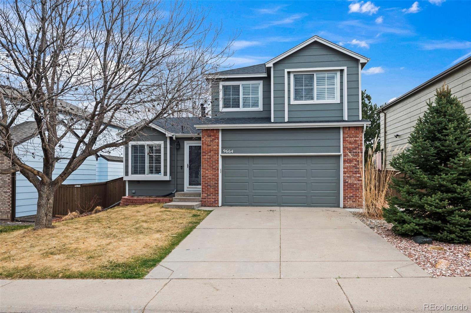 9664 Whitecliff Place Highlands Ranch, CO 80129 - Photo 1 of 46 a front view of a house with yard and trees