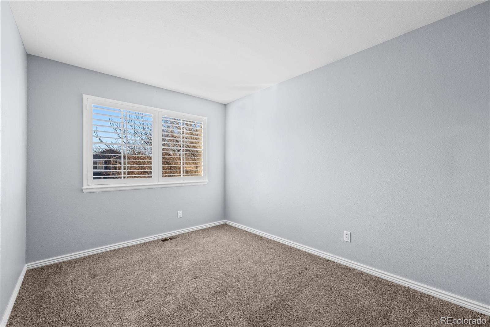 9664 Whitecliff Place Highlands Ranch, CO 80129 - Photo 12 of 38 an empty room with a window