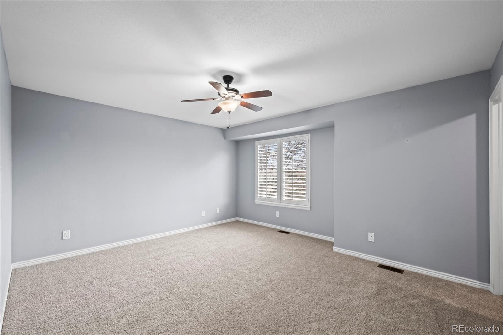 9664 Whitecliff Place Highlands Ranch, CO 80129 - Photo 14 of 46 a view of an empty room with a window