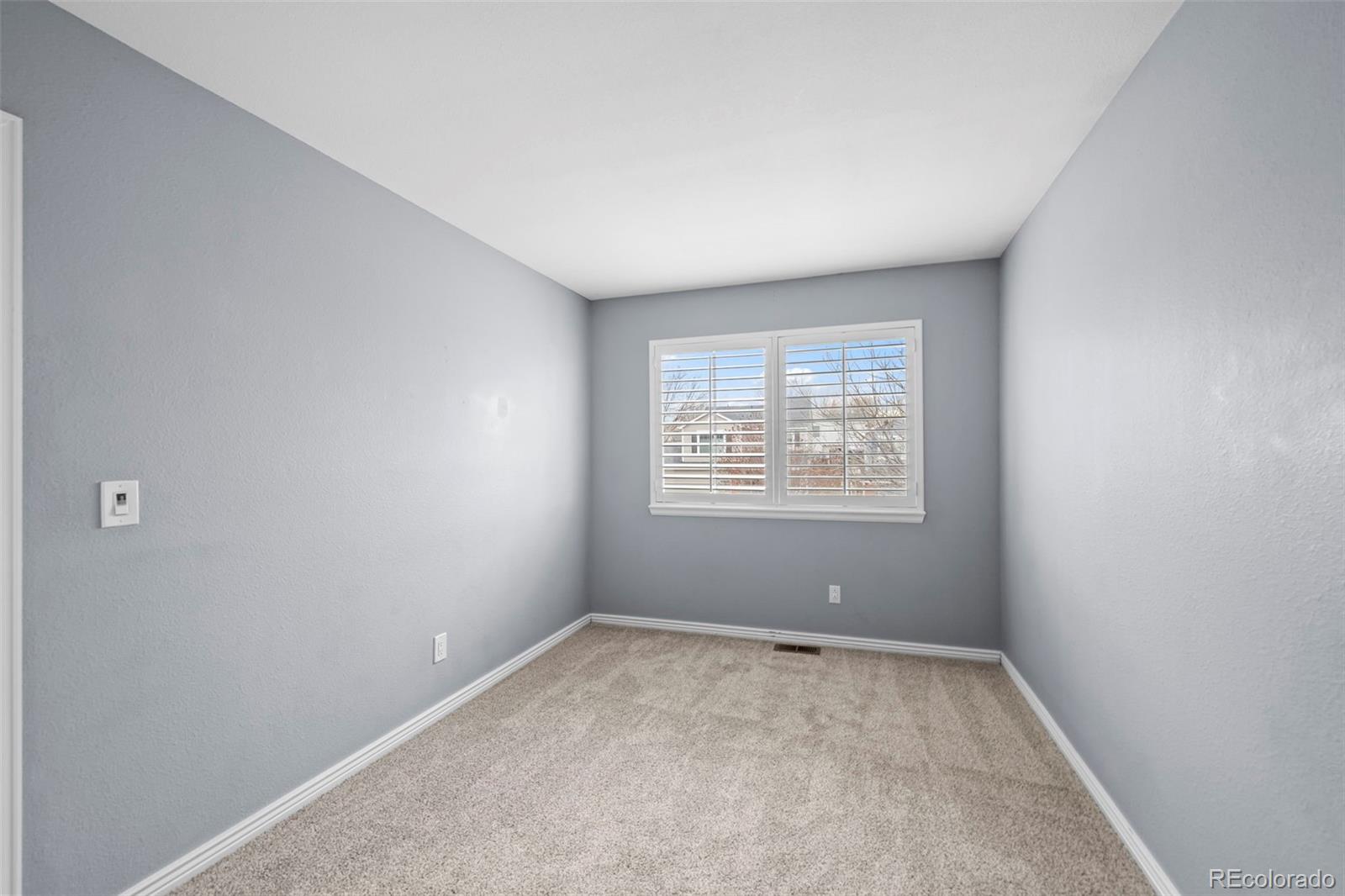 9664 Whitecliff Place Highlands Ranch, CO 80129 - Photo 17 of 46 an empty room with a window