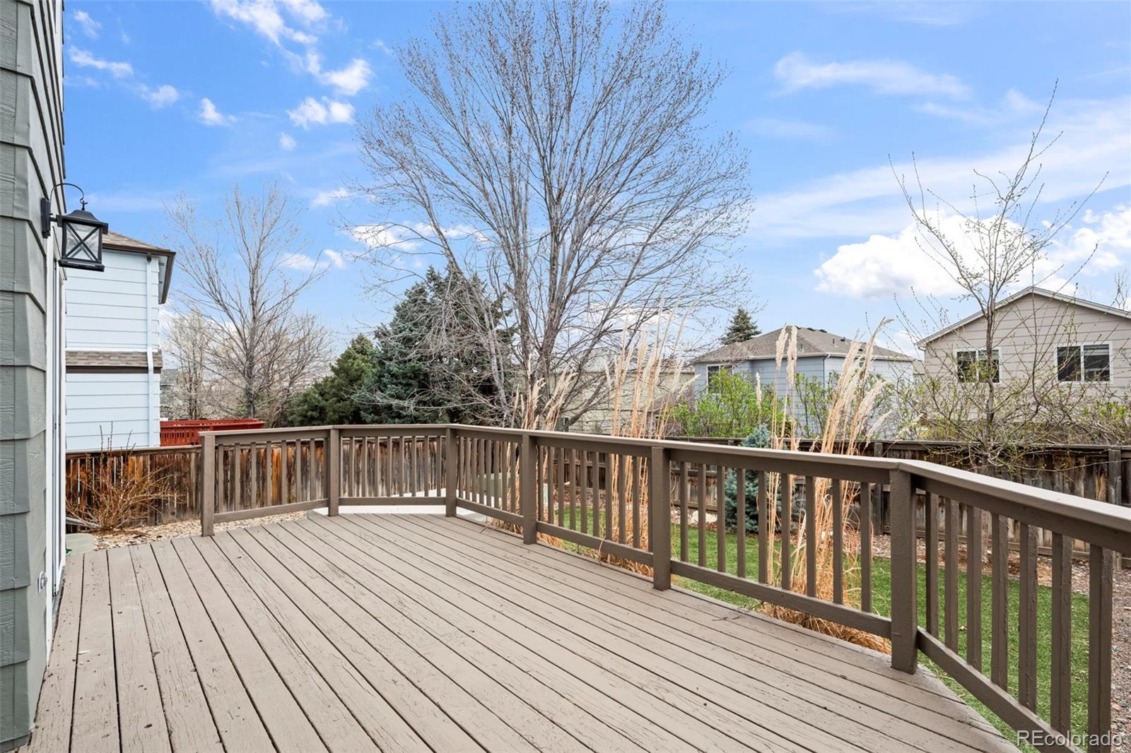 9664 Whitecliff Place Highlands Ranch, CO 80129 - Photo 23 of 46 a view of a wooden deck