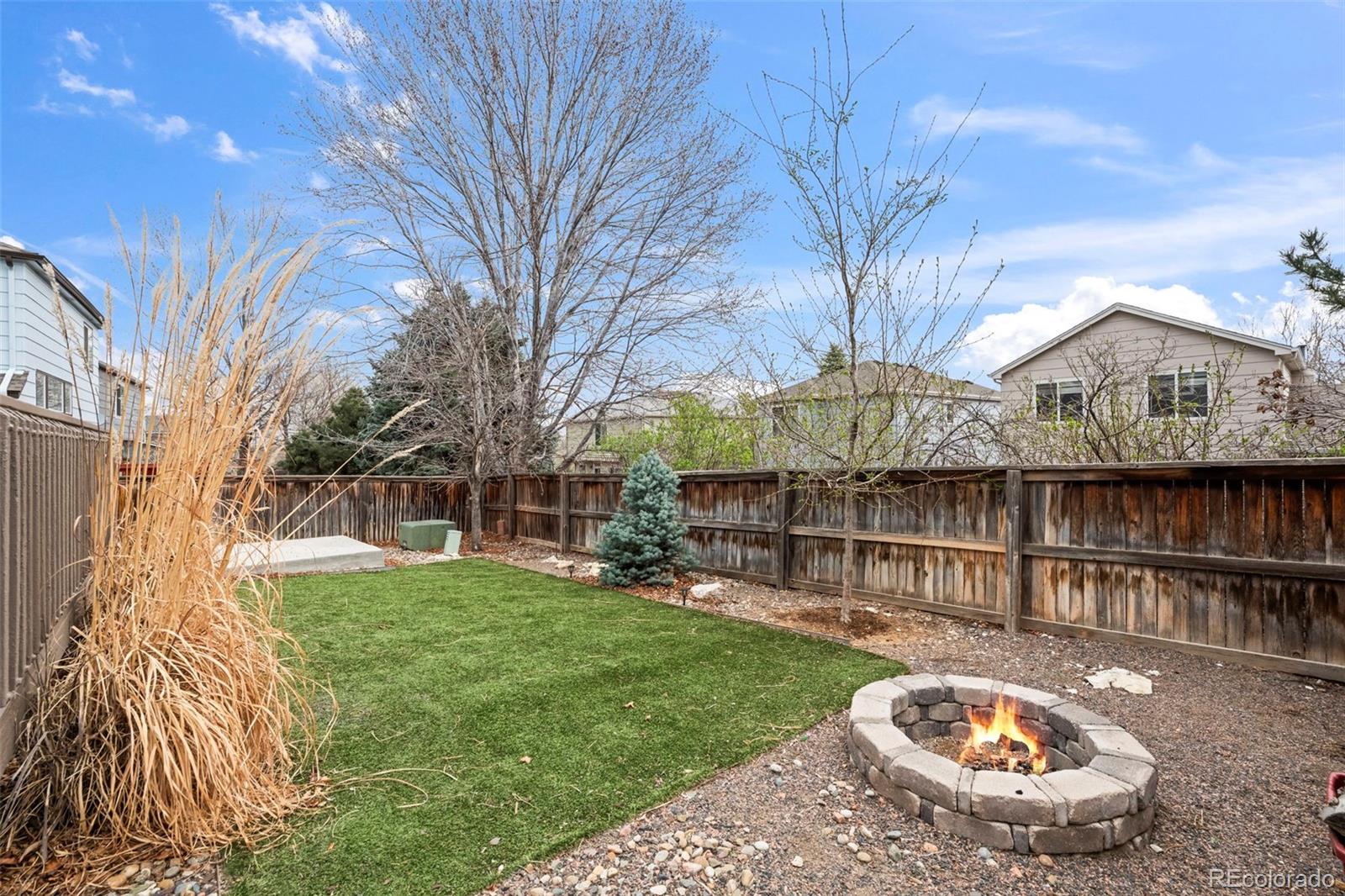 9664 Whitecliff Place Highlands Ranch, CO 80129 - Photo 24 of 46 a view of a house with backyard and sitting area