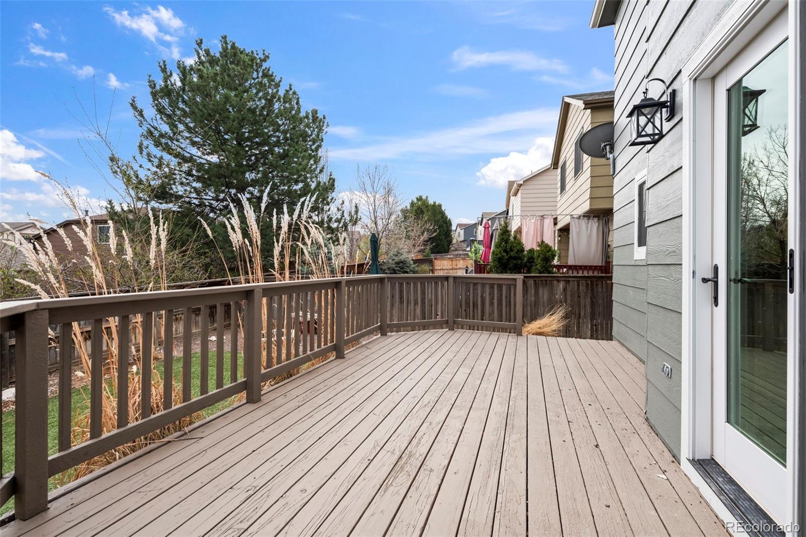 9664 Whitecliff Place Highlands Ranch, CO 80129 - Photo 27 of 46 a view of balcony with wooden floor and fence