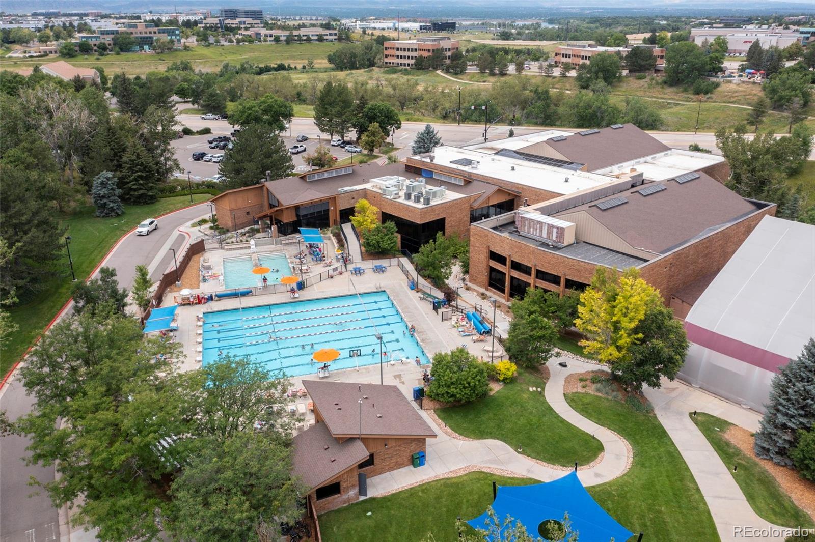 9664 Whitecliff Place Highlands Ranch, CO 80129 - Photo 35 of 38 an aerial view of a house with garden space and lake view