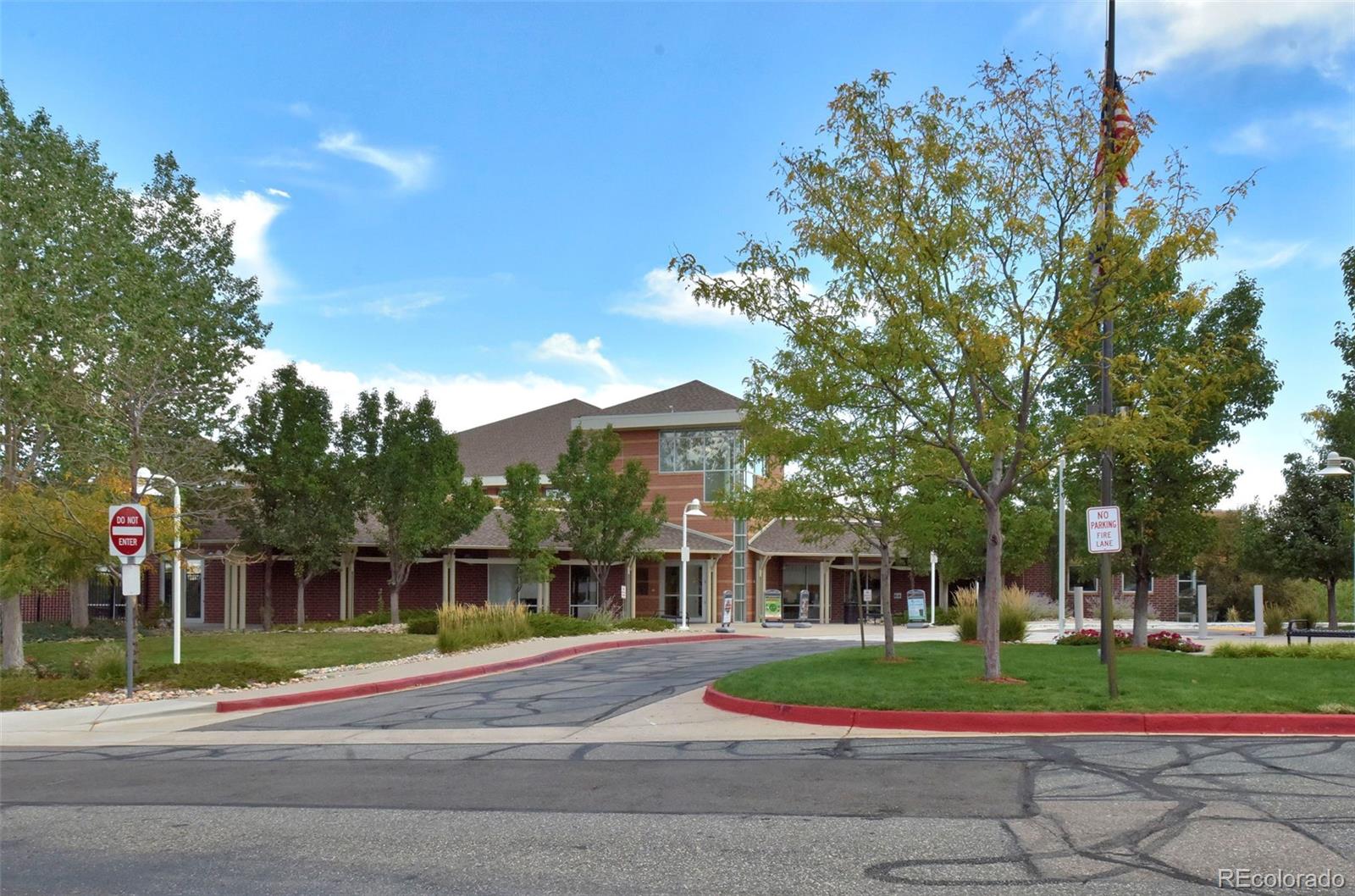 9664 Whitecliff Place Highlands Ranch, CO 80129 - Photo 36 of 38 a front view of a house with a yard