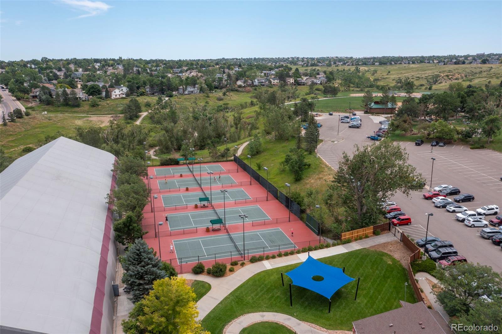 9664 Whitecliff Place Highlands Ranch, CO 80129 - Photo 42 of 46 an aerial view of residential houses with outdoor space and lakeside