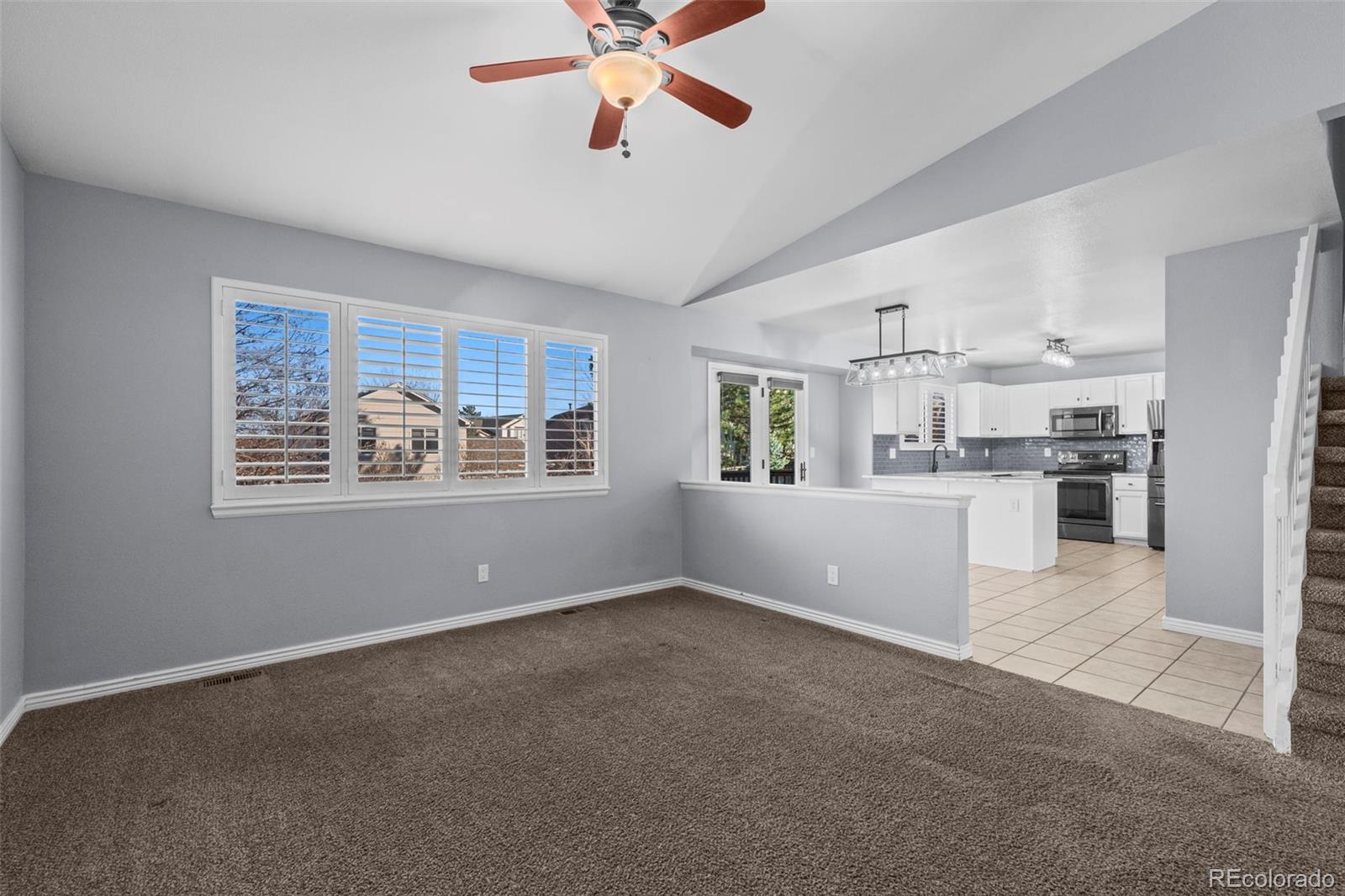 9664 Whitecliff Place Highlands Ranch, CO 80129 - Photo 6 of 38 a view of kitchen with window and ceiling fan