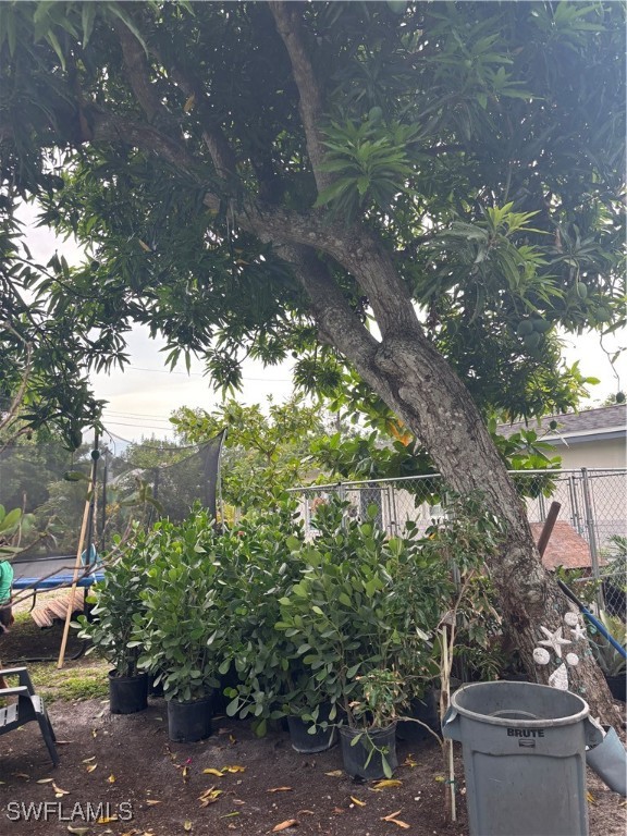 152 Prospect Avenue Fort Myers, FL 33905 - Photo 12 of 18 a backyard of a house with lots of green space and fountain