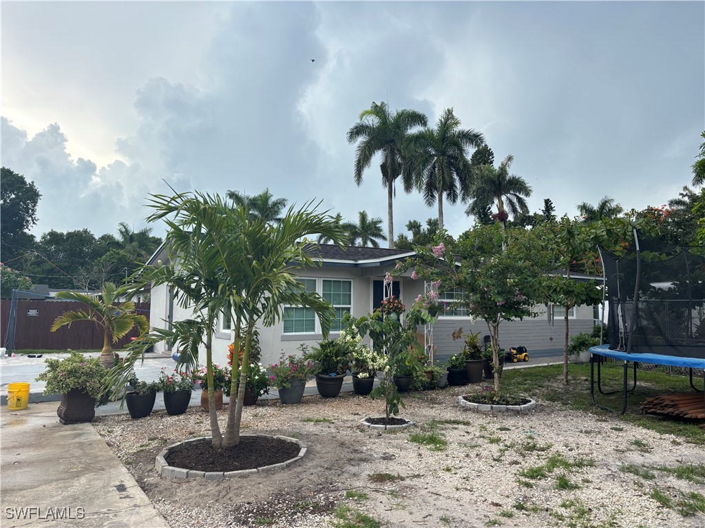 152 Prospect Avenue Fort Myers, FL 33905 - Photo 3 of 18 a front view of a house with garden