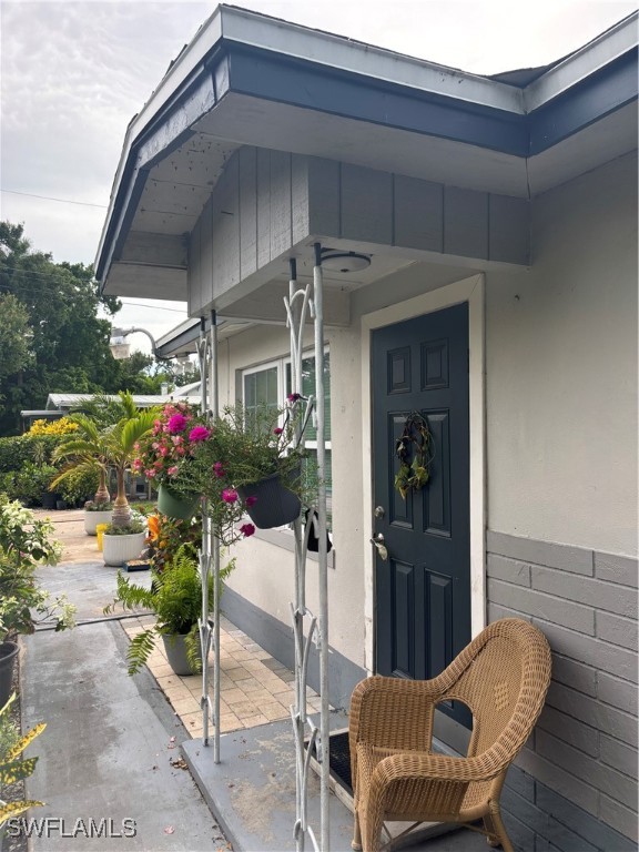 152 Prospect Avenue Fort Myers, FL 33905 - Photo 5 of 18 a patio with table and chairs potted plants