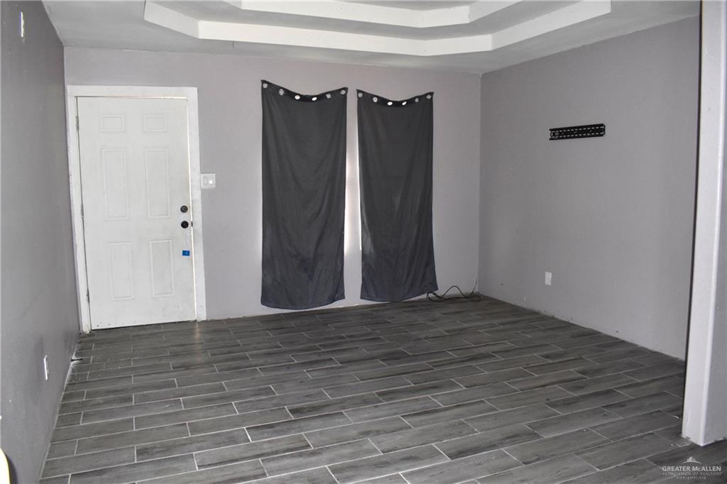 20842 Bohemia Street Edcouch, TX 78538 - Photo 4 of 8 a view of an empty room with wooden floor