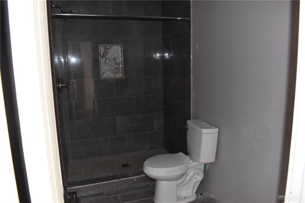20842 Bohemia Street Edcouch, TX 78538 - Photo 6 of 8 a bathroom with a shower and toilet