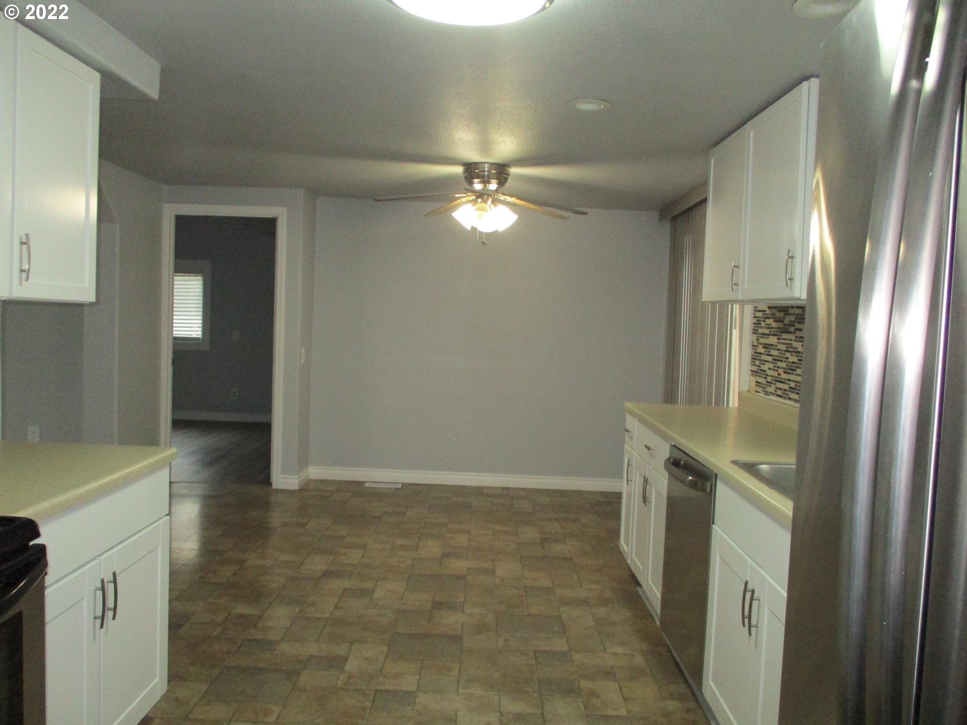 10038 South New Era Road, Unit 2 Canby, OR 97013 - Photo 4 of 20 a bathroom with a light fixture a mirror and a shower