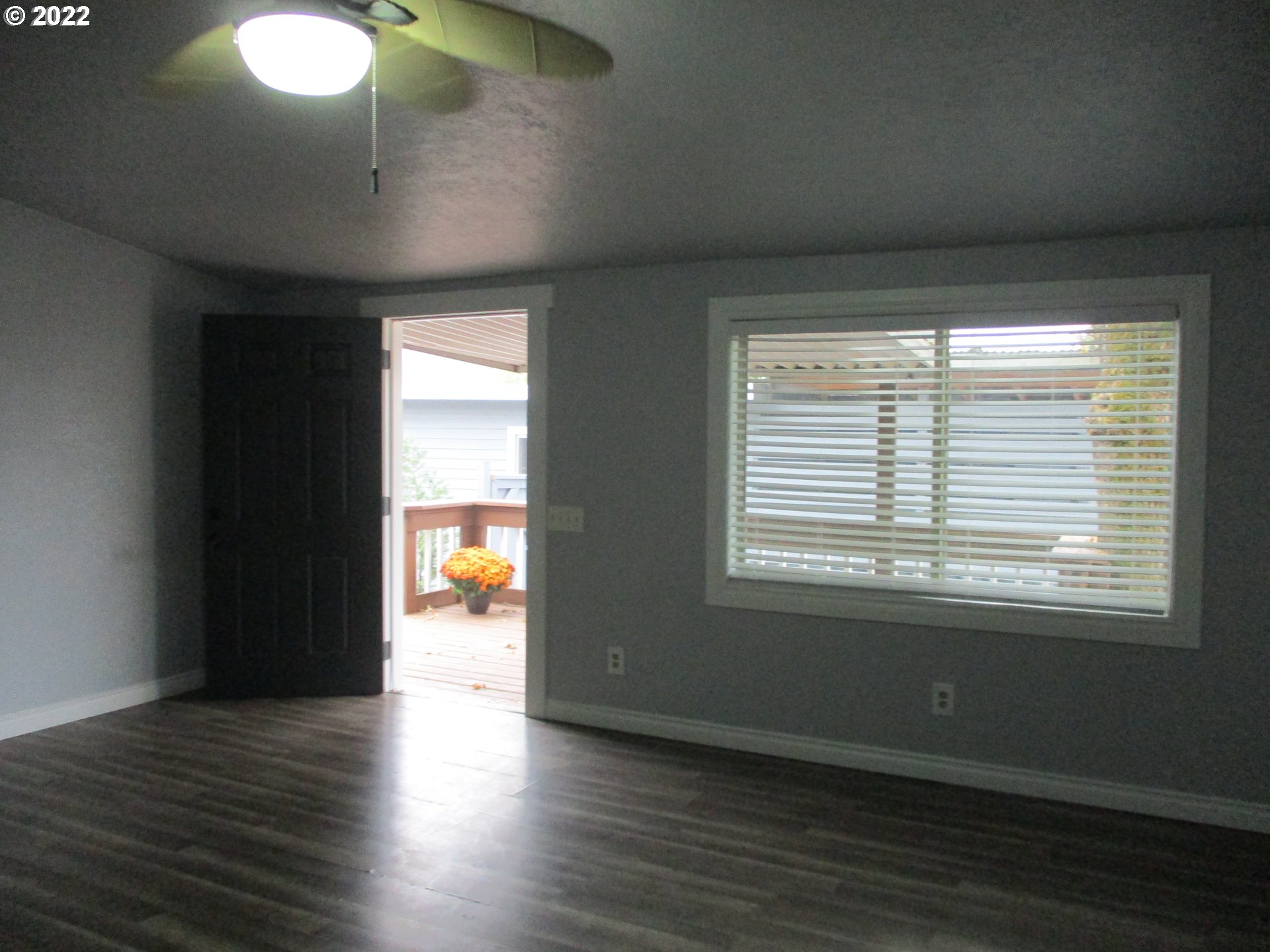 10038 South New Era Road, Unit 2 Canby, OR 97013 - Photo 8 of 20 an empty room with wooden floor and windows