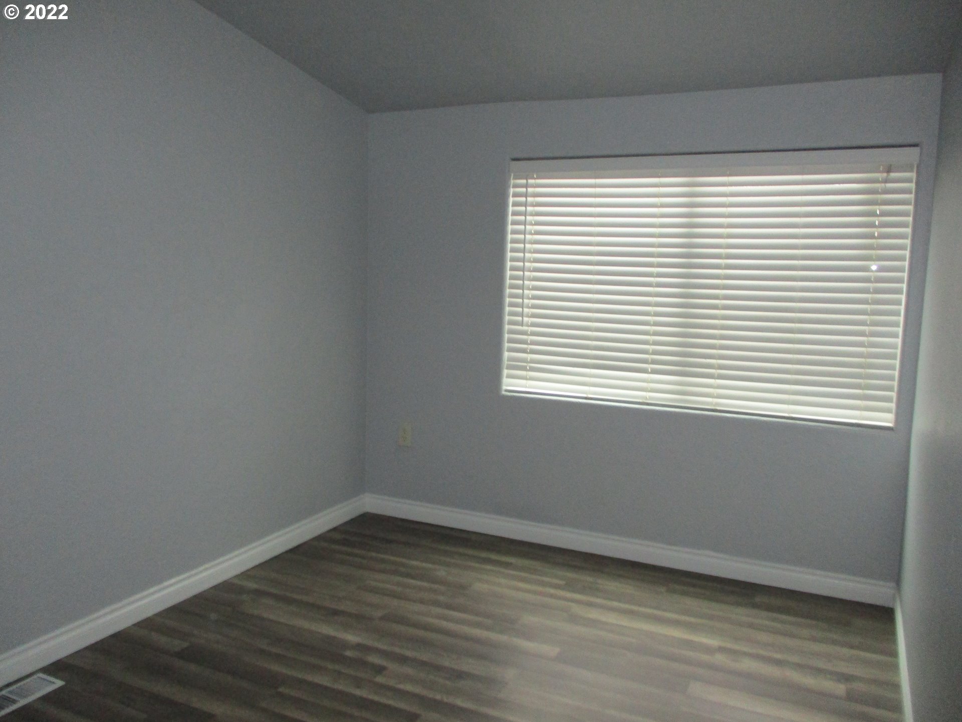 10038 South New Era Road, Unit 2 Canby, OR 97013 - Photo 9 of 20 a view of a small space with wooden floor and a window