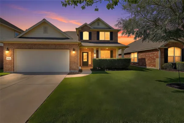 a view of a dining room with furniture and window