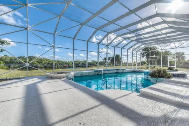 a view of a swimming pool with a patio