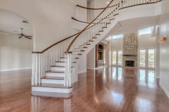 a view of entryway and hall with wooden floor