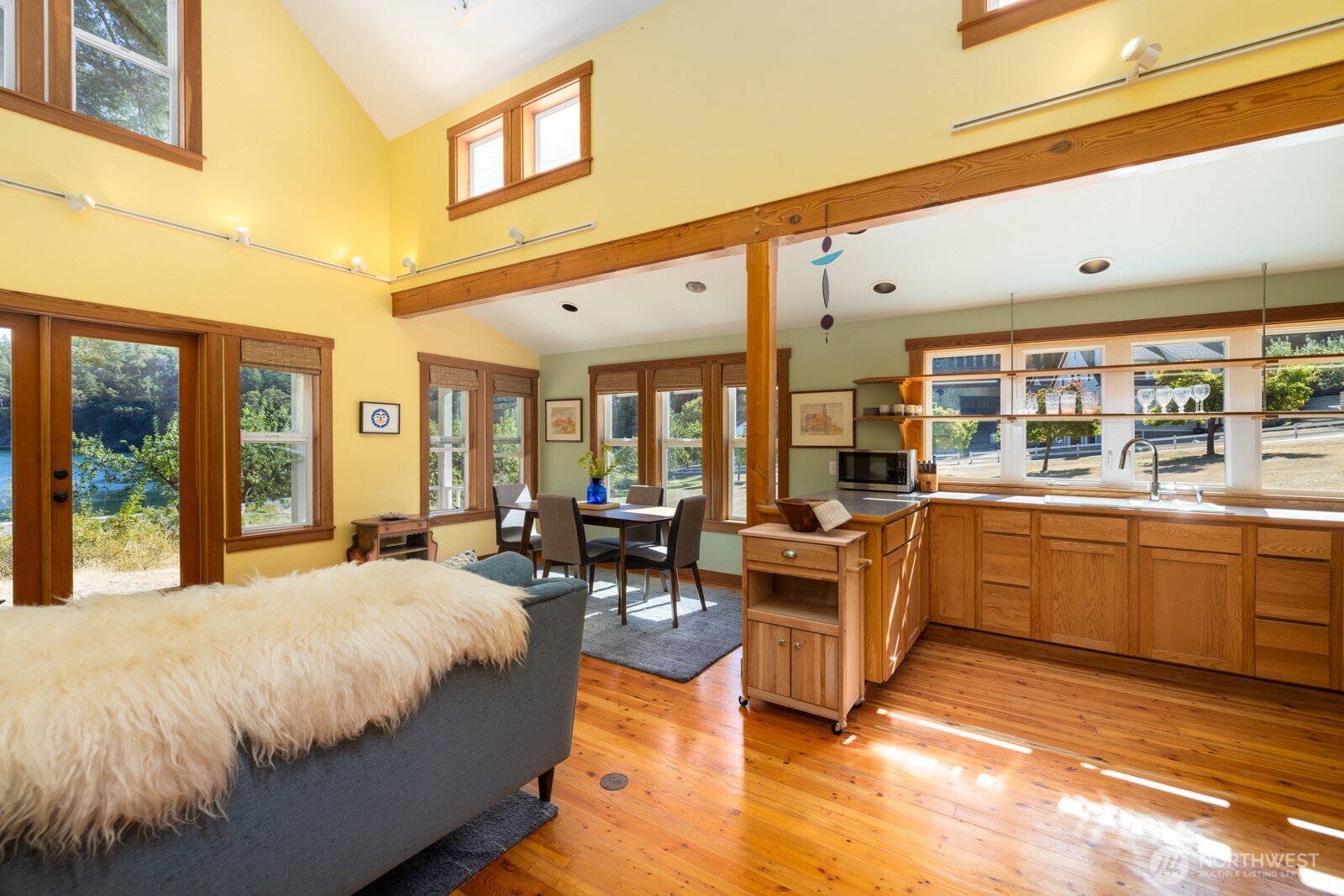 68 Sylvan Cove W Road Decatur Island, WA 98221 - Photo 11 of 35 a large bedroom with wooden floor and furniture