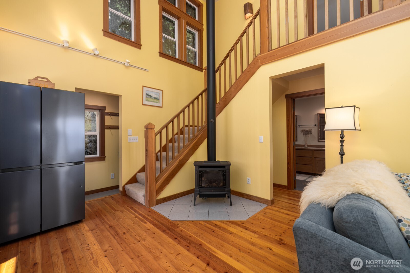 68 Sylvan Cove W Road Decatur Island, WA 98221 - Photo 15 of 35 a view of a livingroom with wooden floor and stairs